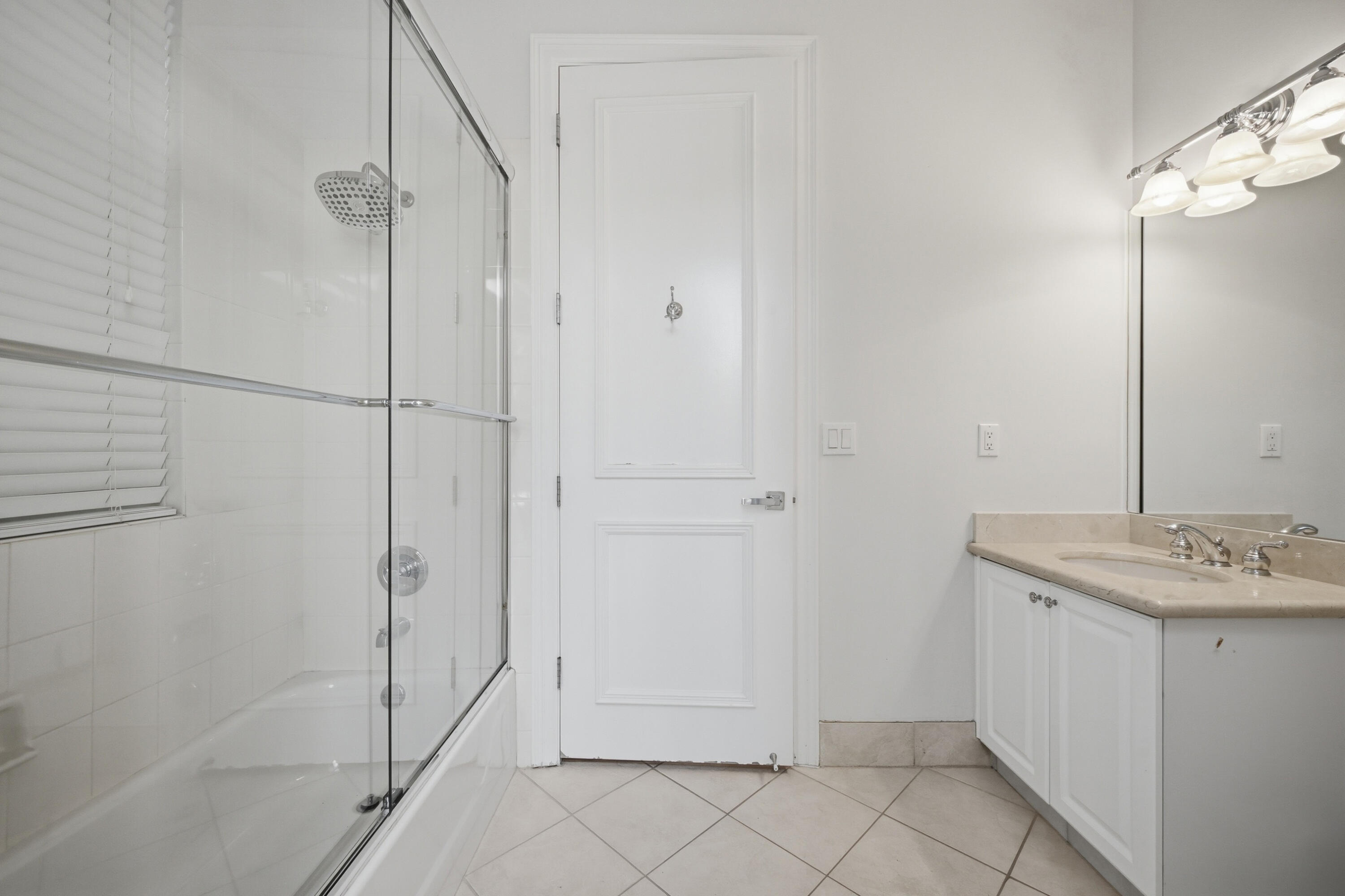 5006 Northwest 24th Circle Boca Raton, FL 33431 - Photo 35 of 52 a bathroom with a sink and a mirror
