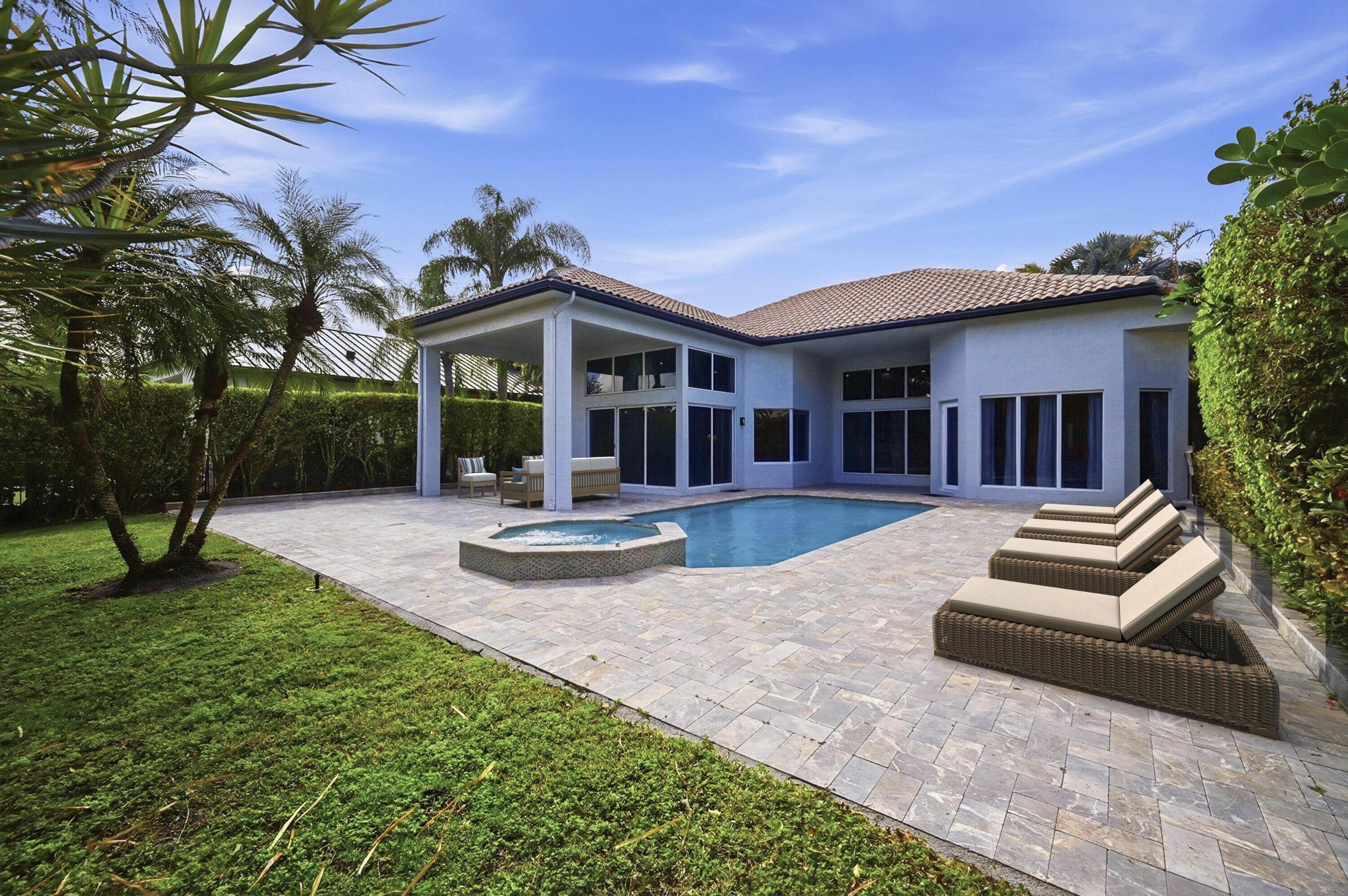 5006 Northwest 24th Circle Boca Raton, FL 33431 - Photo 38 of 52 a view of a house with a yard and a patio