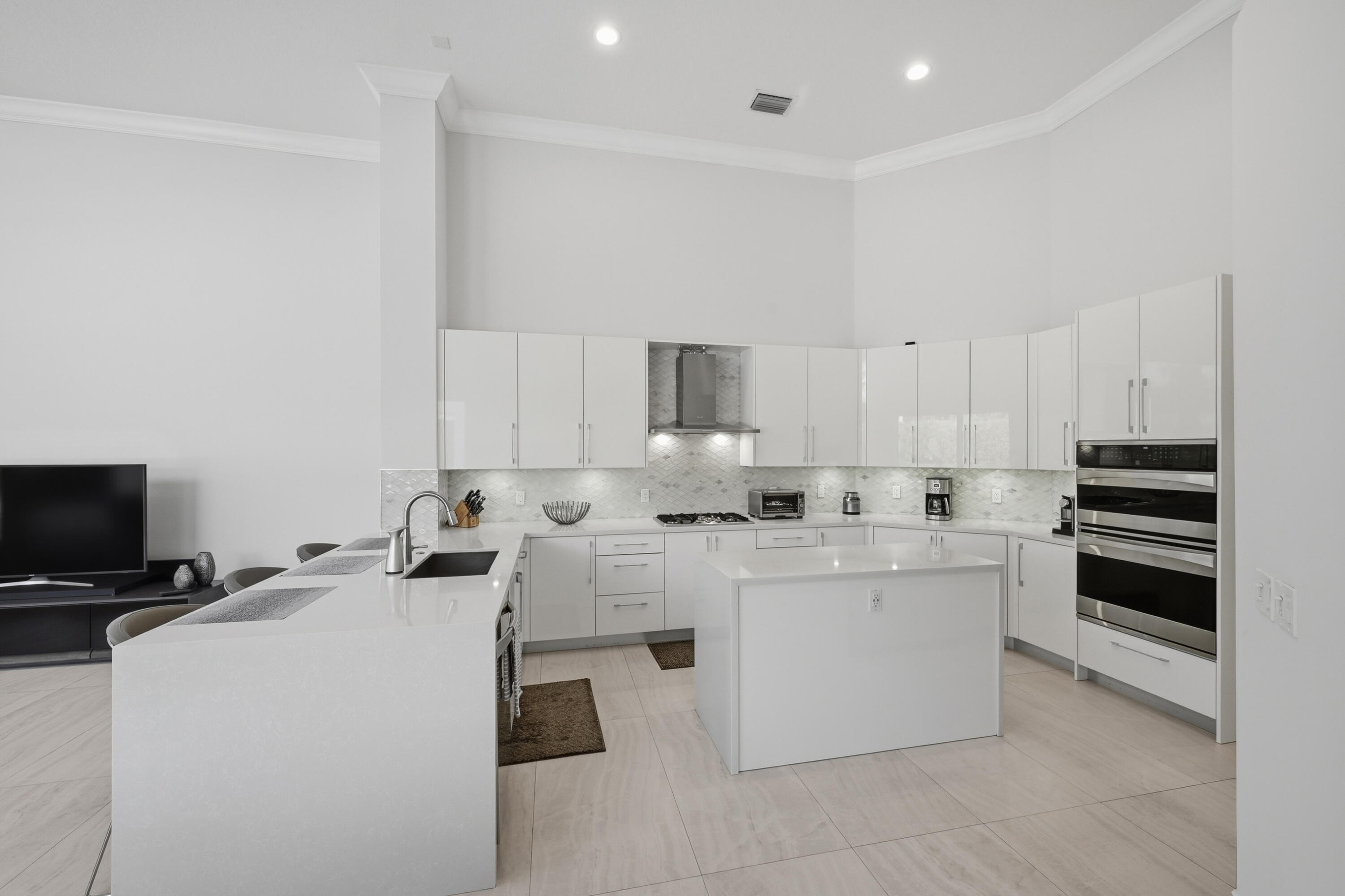 5006 Northwest 24th Circle Boca Raton, FL 33431 - Photo 10 of 52 a kitchen with appliances a sink and cabinets