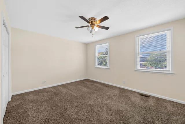 an view of an empty room with window