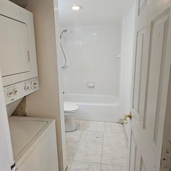 4174 Inverrary Drive, Unit 702 Lauderhill, FL 33319 - Photo 4 of 10 a bathroom with a toilet and a shower