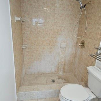 4174 Inverrary Drive, Unit 702 Lauderhill, FL 33319 - Photo 7 of 10 a bathroom with a toilet and shower