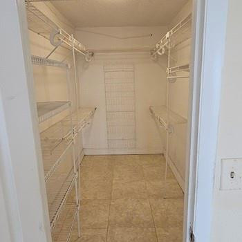 4174 Inverrary Drive, Unit 702 Lauderhill, FL 33319 - Photo 8 of 10 a bathroom with a shower and a glass door