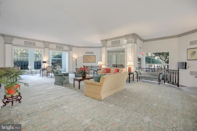 a living room with furniture and a table