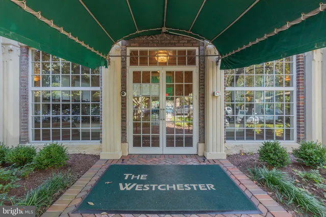 a view of front door and small yard