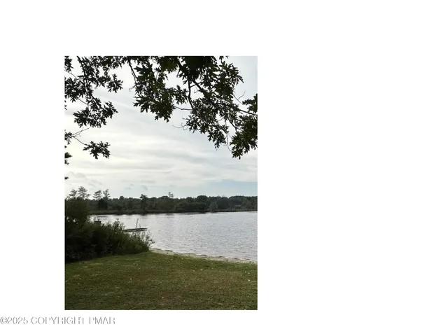 a view of mountain with lake view