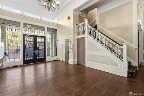 a view of an entryway with wooden floor