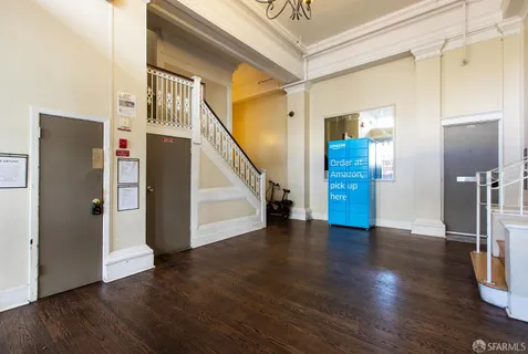 a view of an entryway with wooden floor