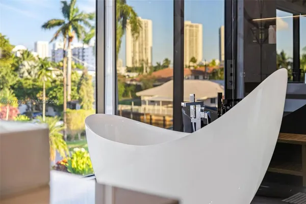 an aerial view of a city with lots of residential buildings ocean and ocean view