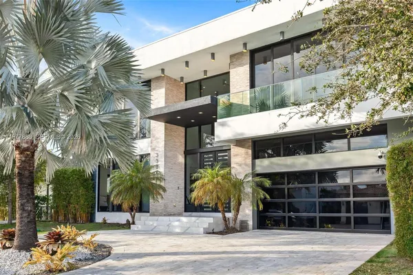 a view of living room with furniture and floor to ceiling windows