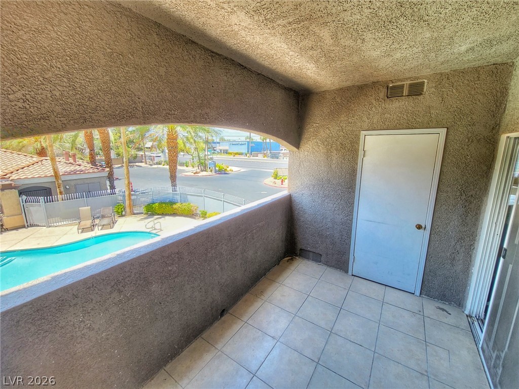 5525 West Flamingo Road, Unit 2040 Las Vegas, NV 89103 - Photo 15 of 15 A private balcony provides a relaxing perch overlooking the community pool and vibrant streetscape.