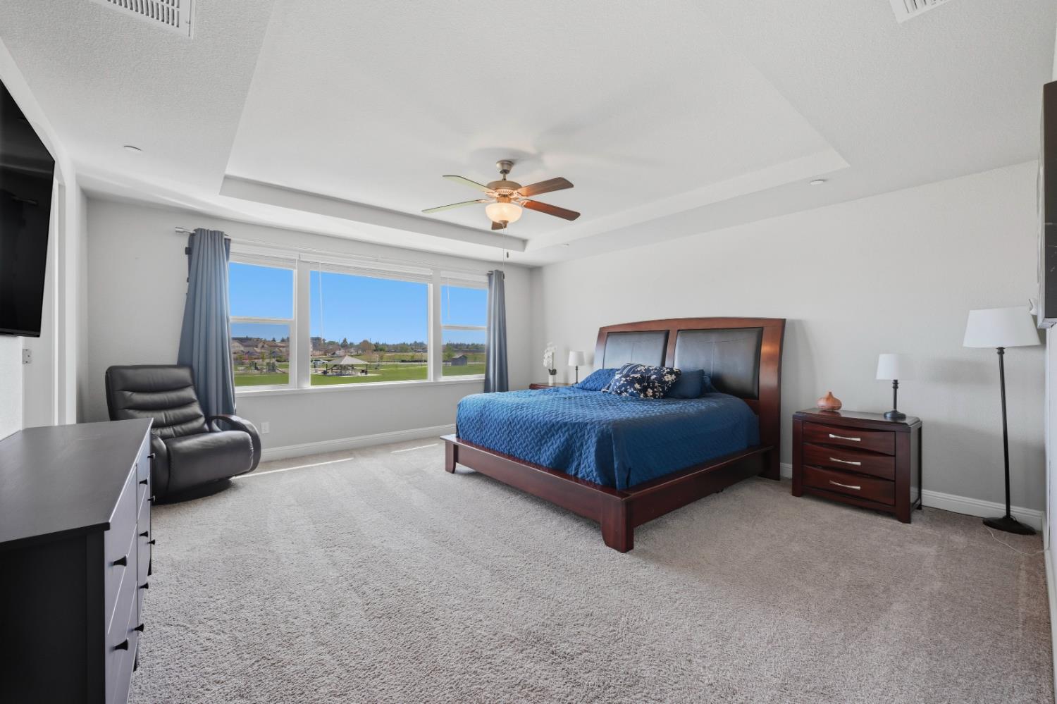 2012 Van Ruiten Drive Lodi, CA 95242 - Photo 28 of 48 a bedroom with a bed and a couch
