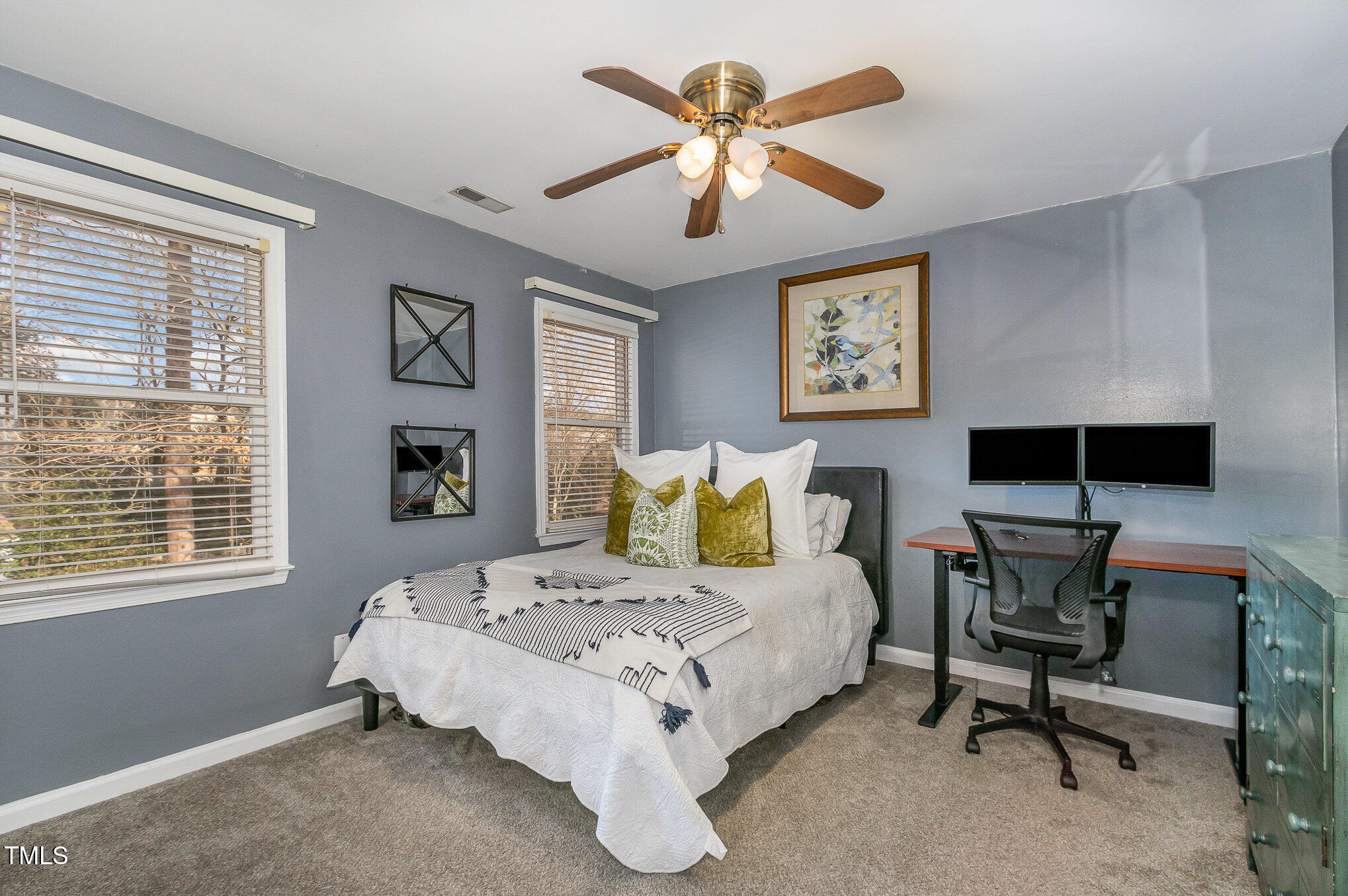 401 Rosehaven Drive Raleigh, NC 27609 - Photo 17 of 26 This secondary bedroom is large enough for a bed, desk, and dresser.