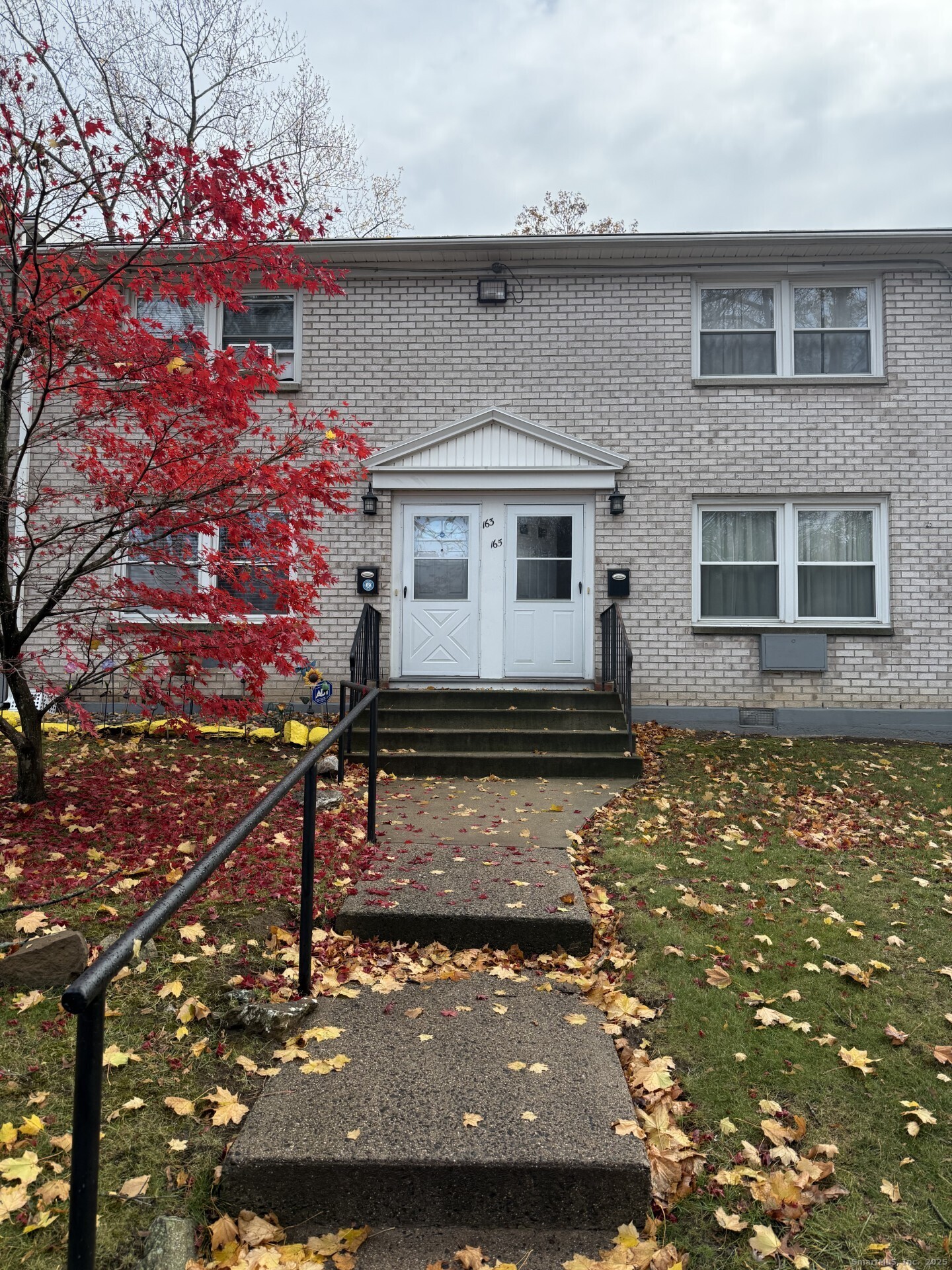 front view of house with a large window