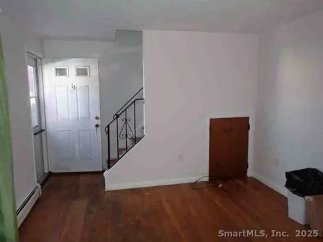 a view of entryway with wooden floor