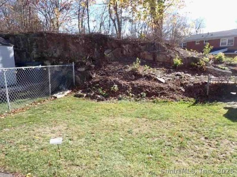 165 Yaremich Drive Bridgeport, CT 06606 - Photo 9 of 9 a backyard of a house with lots of green space