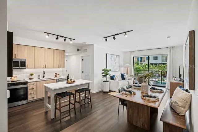 a view of a room with gym equipment and a large window