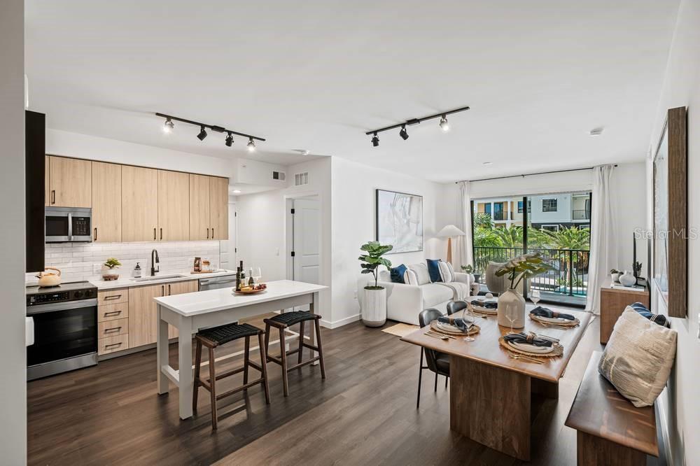 901 West Chestnut Street, Unit B507 Tampa, FL 33607 - Photo 16 of 20 a view of a dining room with furniture window and wooden floor