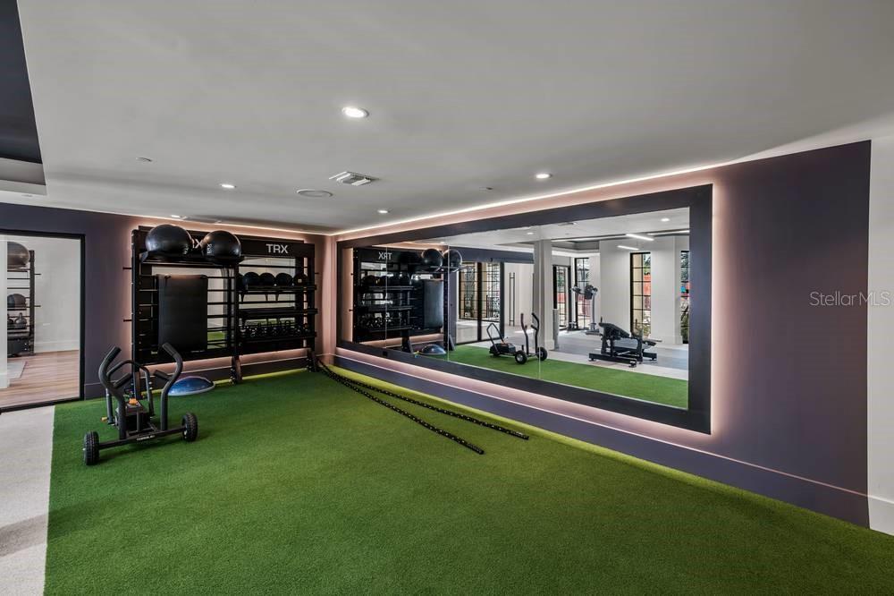 901 West Chestnut Street, Unit B507 Tampa, FL 33607 - Photo 19 of 20 a view of a room with gym equipment and a large window