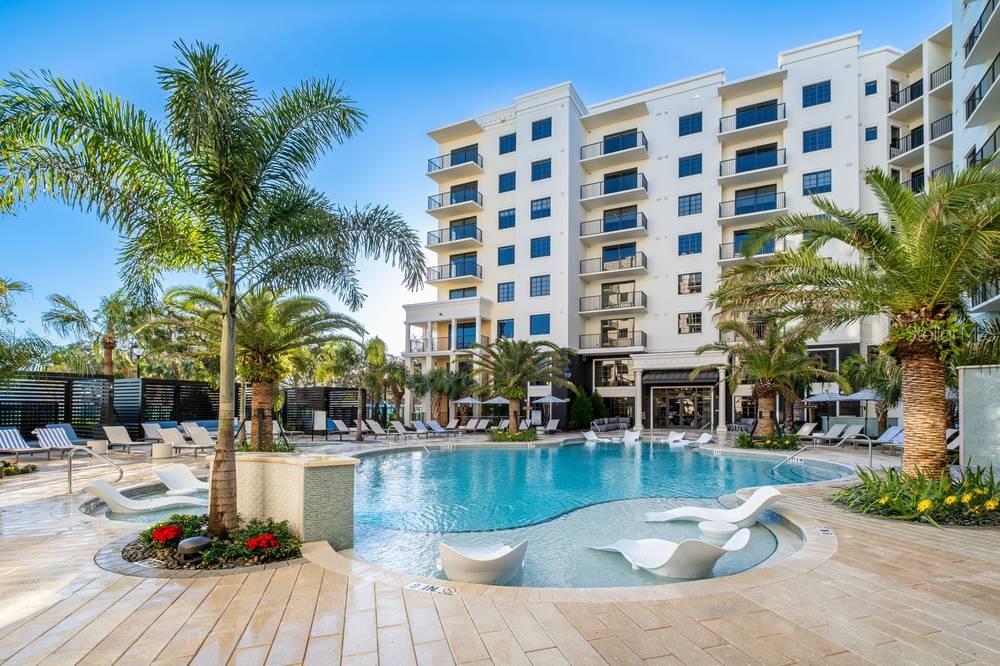 901 West Chestnut Street, Unit B507 Tampa, FL 33607 - Photo 20 of 20 a view of swimming pool with outdoor seating and plants
