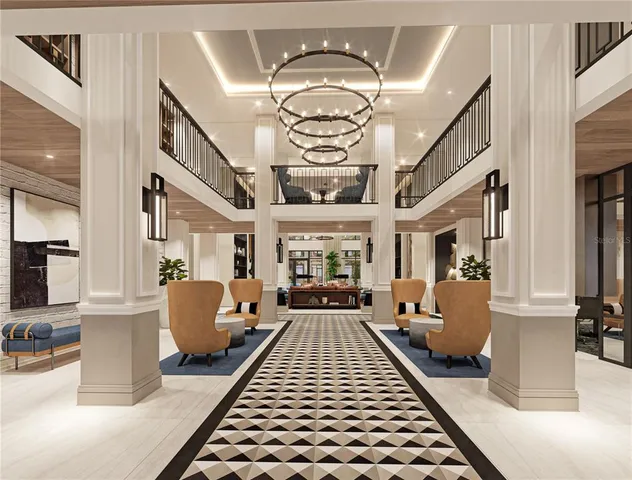 a living room with furniture a flat screen tv and paintings on the wall