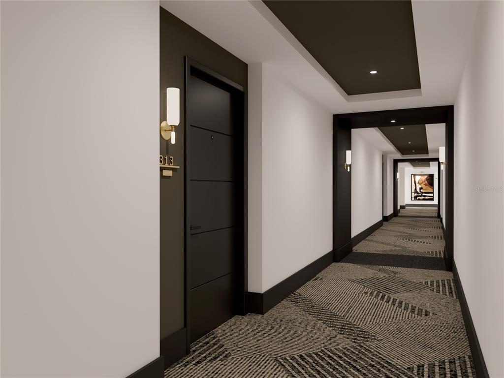 901 West Chestnut Street, Unit B507 Tampa, FL 33607 - Photo 10 of 20 a hallway with wooden floor and staircase