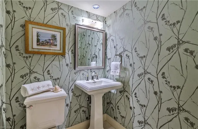 a bathroom with a toilet and a sink