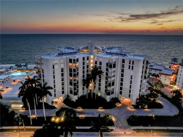 a view of a patio with table and chairs potted plants