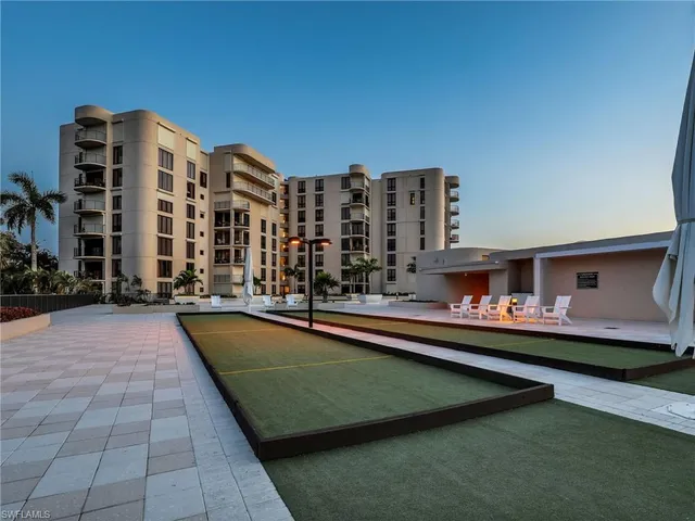 a view of a patio with swimming pool table and chairs