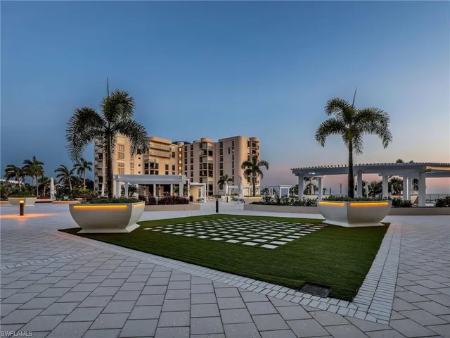 a view of a swimming pool and lounge chair