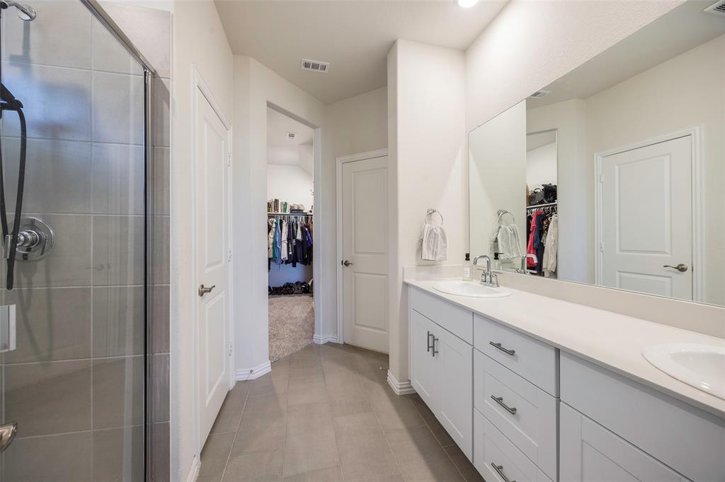 307 Quarry Street Melissa, TX 75454 - Photo 14 of 25 a bathroom with a double vanity sink mirror and shower