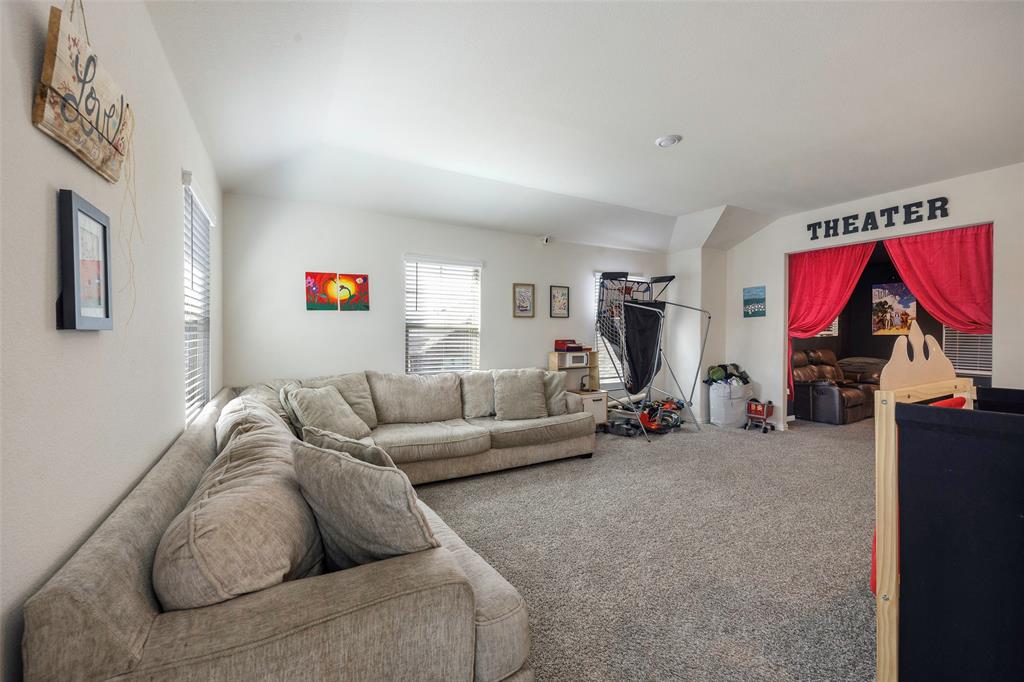 307 Quarry Street Melissa, TX 75454 - Photo 16 of 25 a living room with furniture and a flat screen tv