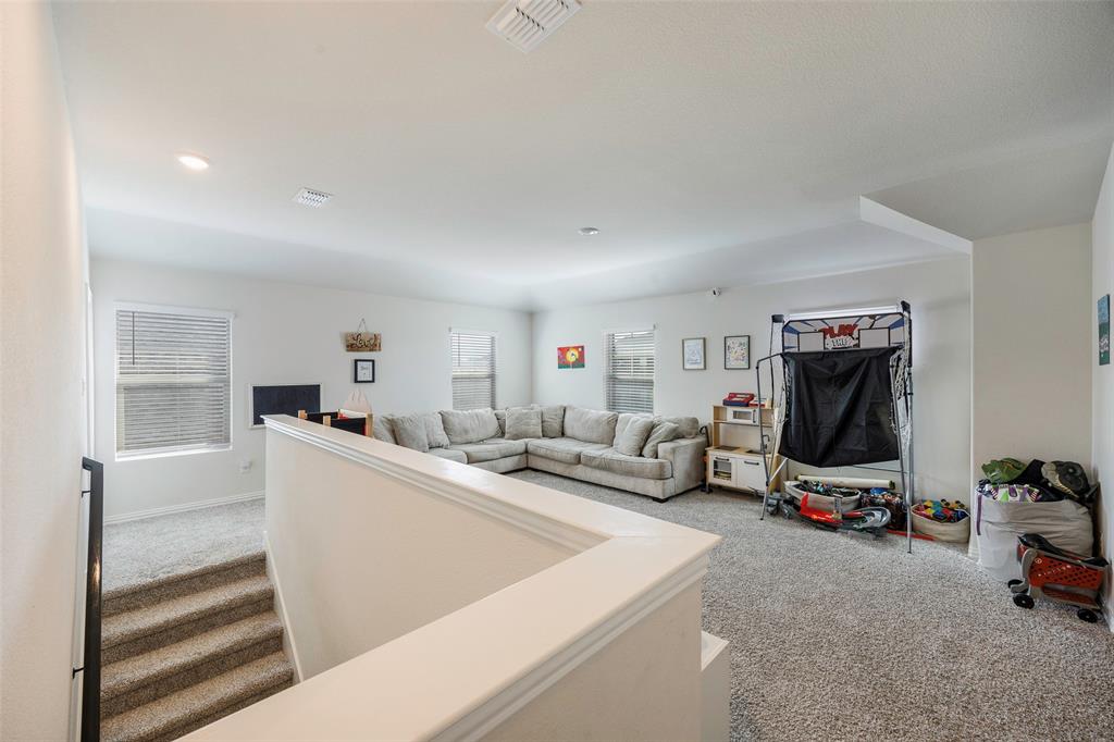 307 Quarry Street Melissa, TX 75454 - Photo 19 of 25 a living room with furniture and a flat screen tv