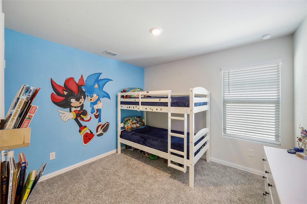 307 Quarry Street Melissa, TX 75454 - Photo 20 of 25 a bedroom with a bed and a window