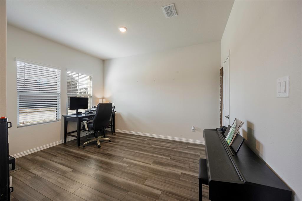 307 Quarry Street Melissa, TX 75454 - Photo 24 of 25 a view of a workspace with furniture and a window