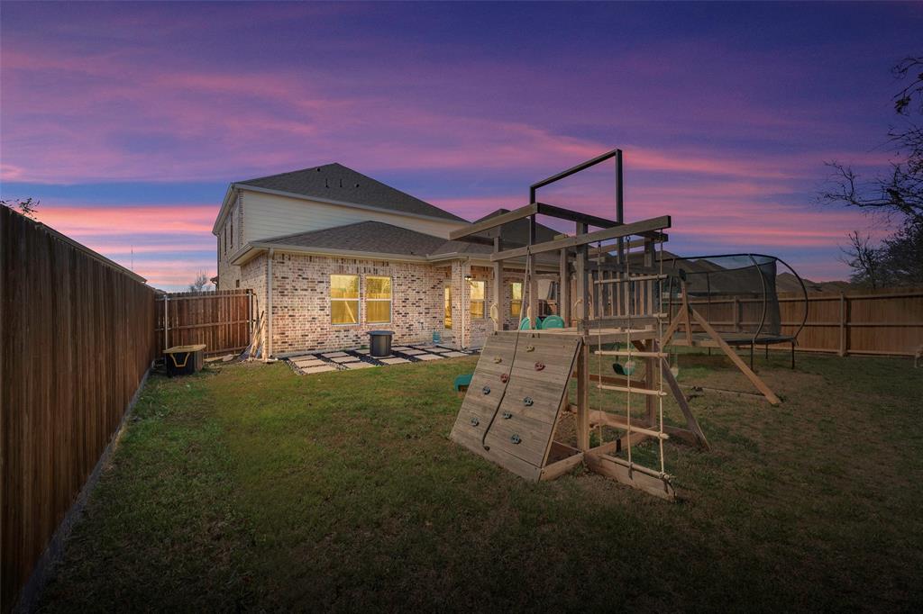 307 Quarry Street Melissa, TX 75454 - Photo 25 of 25 a front view of a house with garden