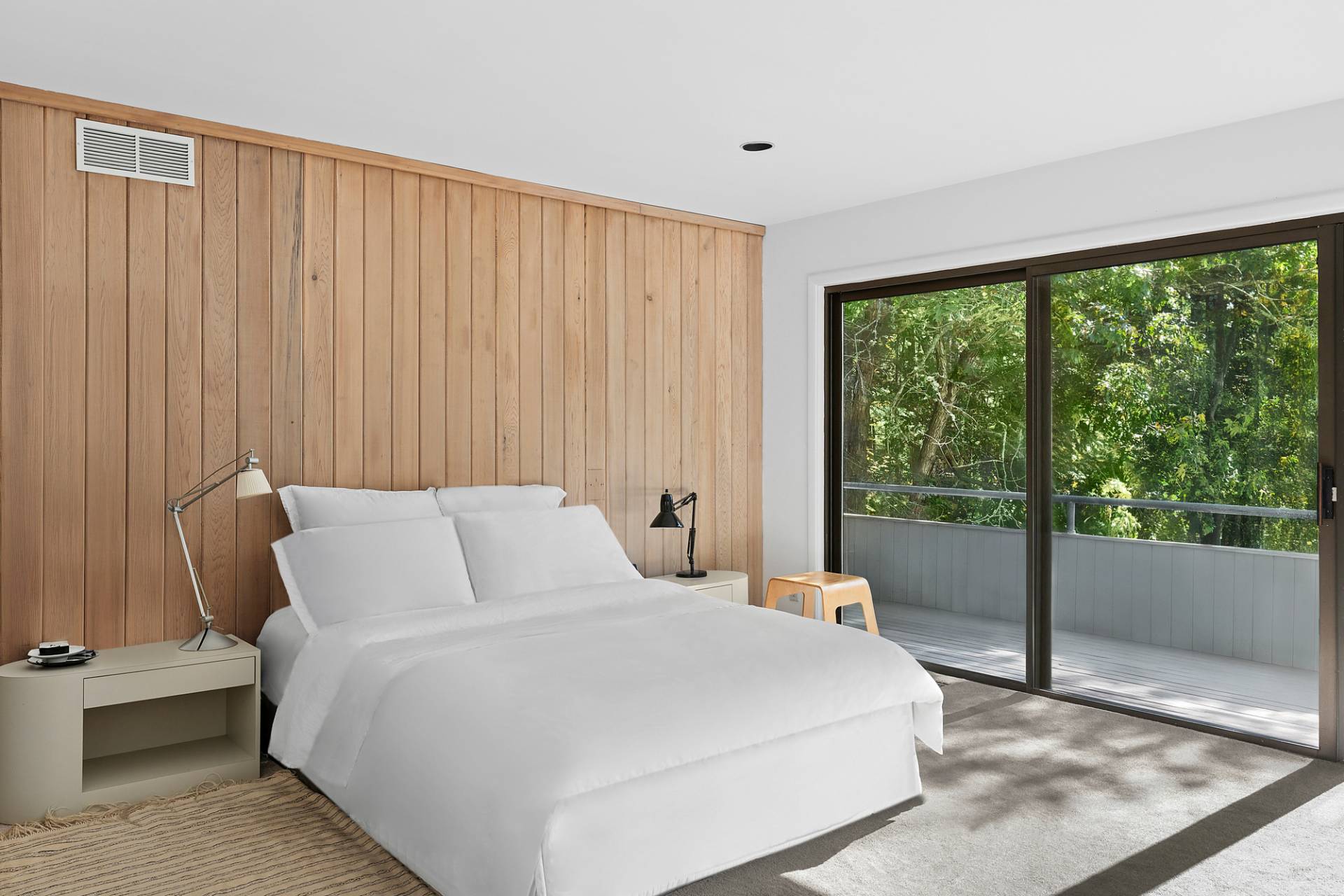 15 2 Holes Water Road East Hampton, NY 11937 - Photo 12 of 30 a bedroom with a large bed and a large window