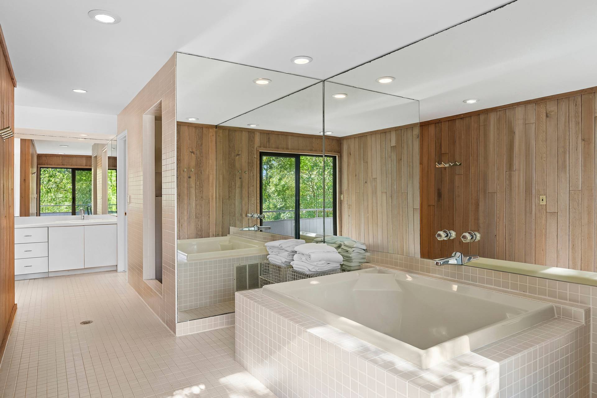 15 2 Holes Water Road East Hampton, NY 11937 - Photo 15 of 30 a bathroom with a large tub a sink and large window
