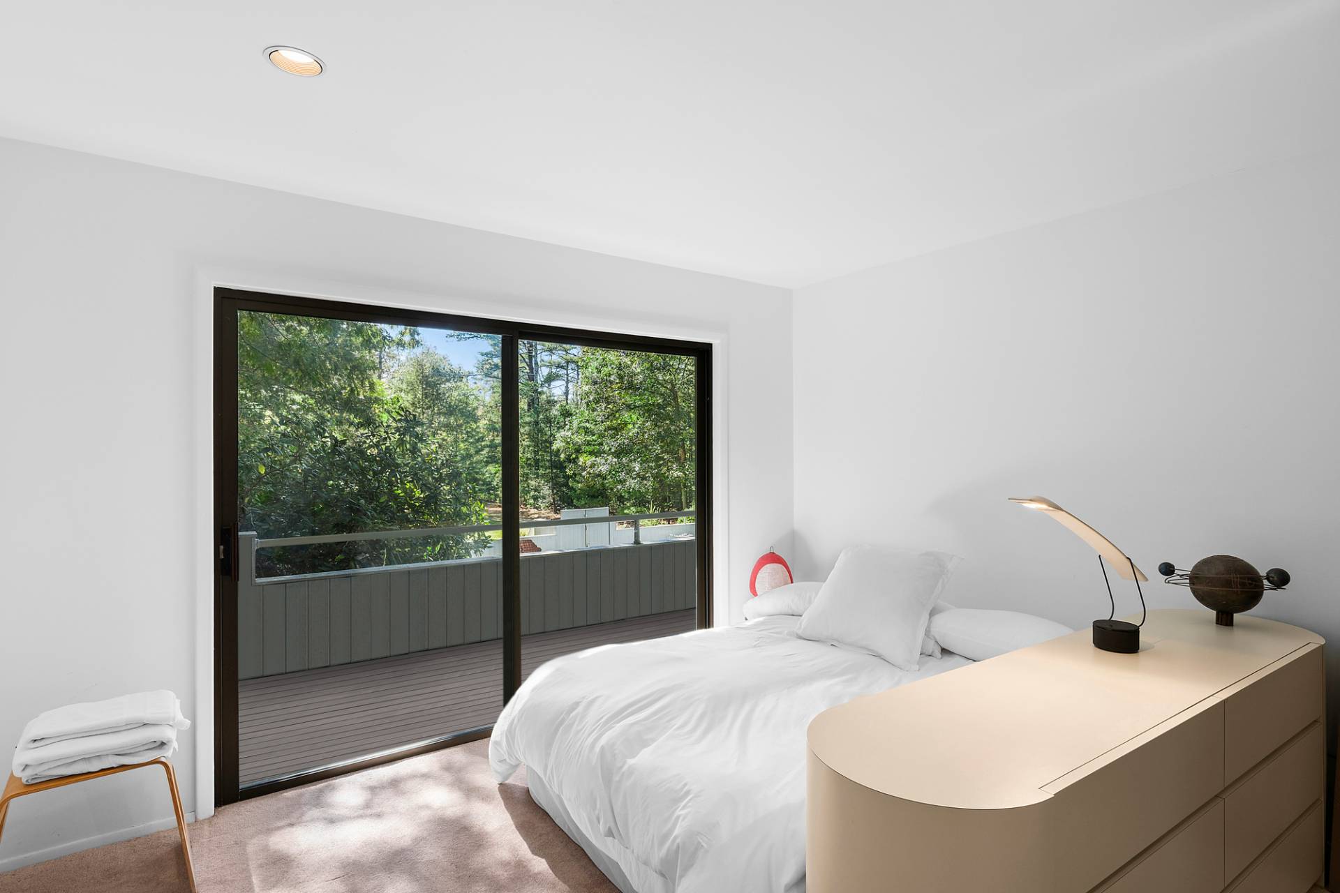 15 2 Holes Water Road East Hampton, NY 11937 - Photo 18 of 30 a bedroom with a bed and wooden floor