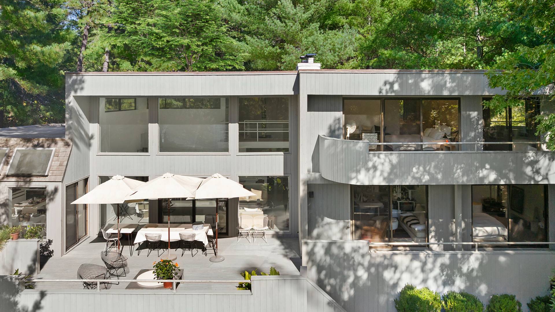 15 2 Holes Water Road East Hampton, NY 11937 - Photo 3 of 30 a view of a patio with table and chairs potted plants with wooden floor