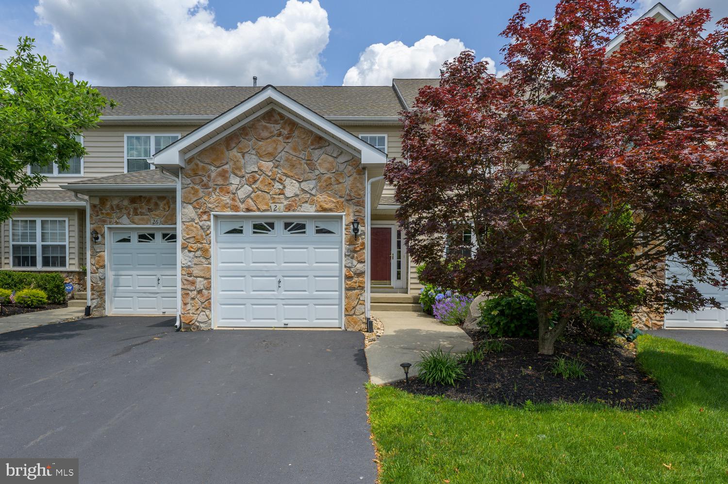 24 Hogan Way Moorestown, NJ 08057 - Photo 1 of 15 a view of a house with a small yard and a large tree