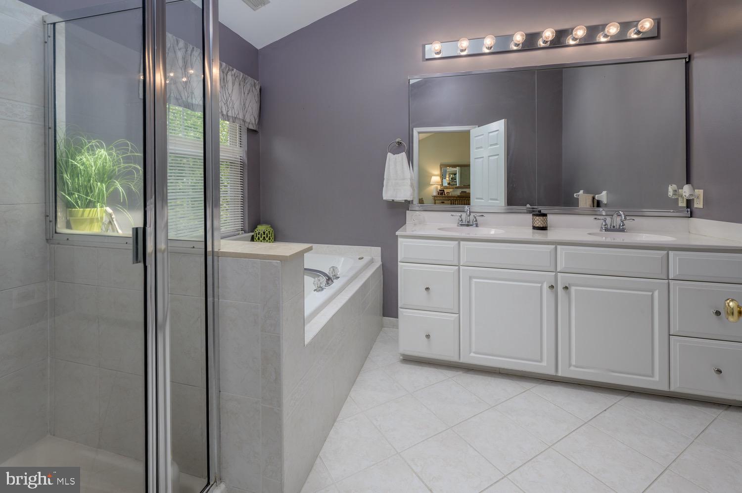 24 Hogan Way Moorestown, NJ 08057 - Photo 11 of 15 a spacious bathroom with a double vanity sink a mirror and a shower