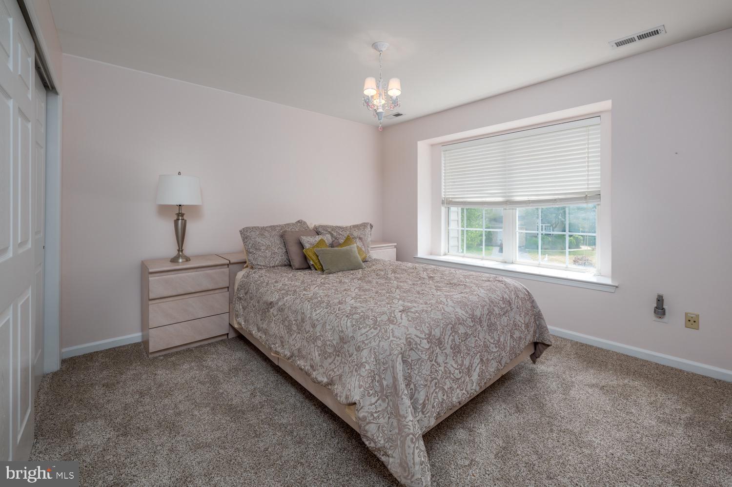 24 Hogan Way Moorestown, NJ 08057 - Photo 12 of 15 a bedroom with a bed and a window