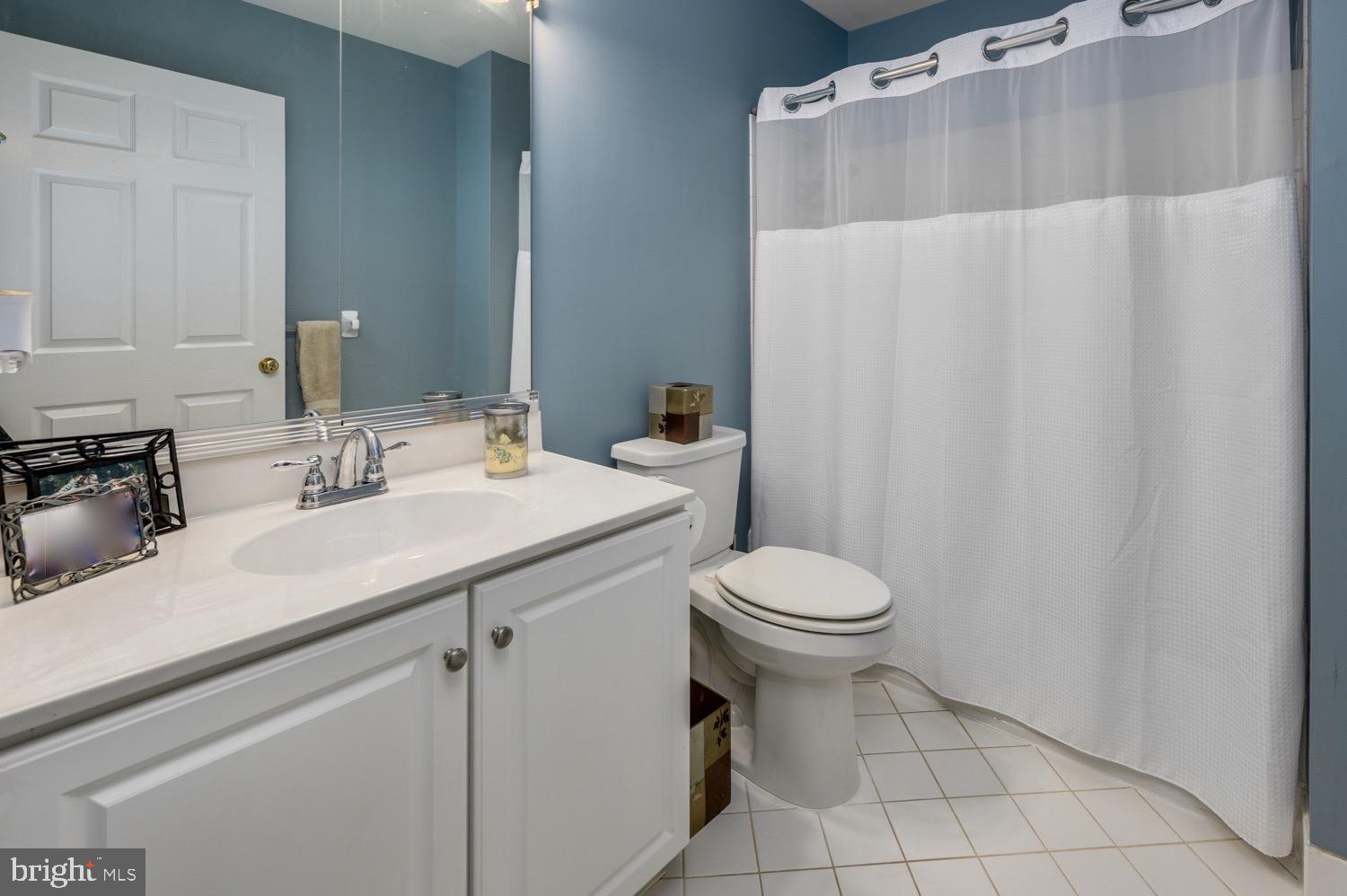 24 Hogan Way Moorestown, NJ 08057 - Photo 13 of 15 a bathroom with a sink a toilet and a mirror