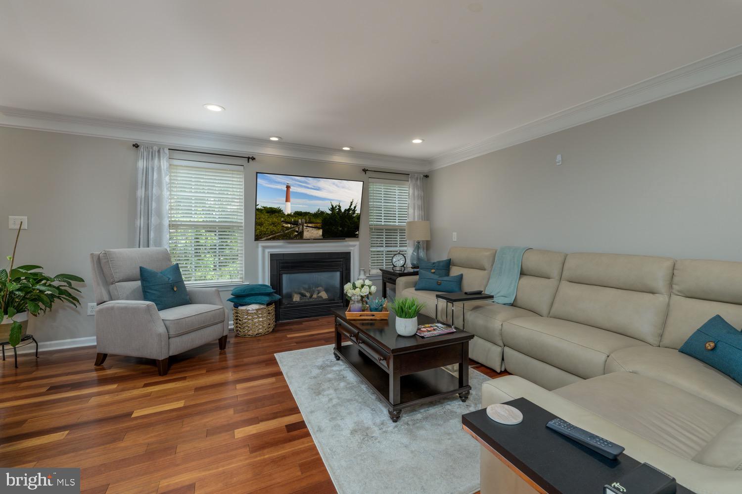 24 Hogan Way Moorestown, NJ 08057 - Photo 6 of 15 a living room with furniture a fireplace and a table