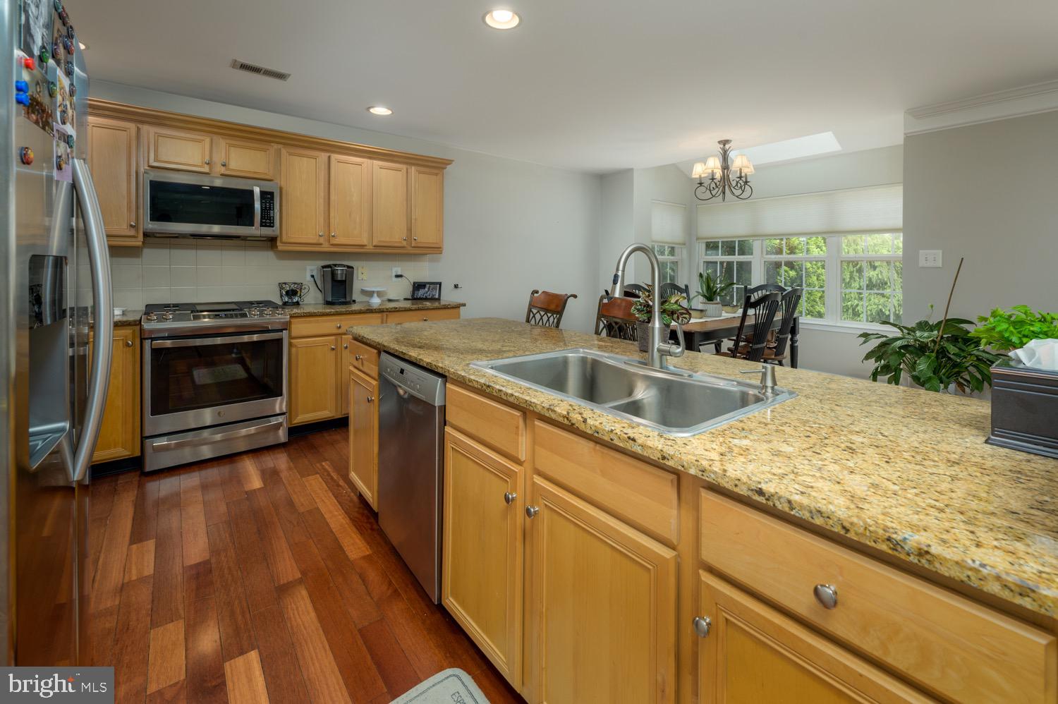 24 Hogan Way Moorestown, NJ 08057 - Photo 7 of 15 a kitchen with sink a microwave and cabinets