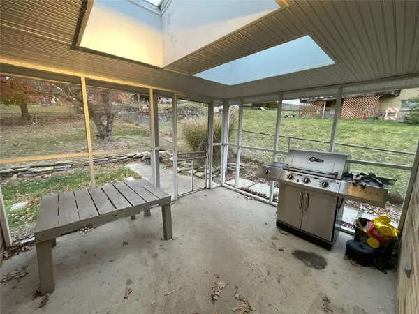 a view of a chairs and table in the patio