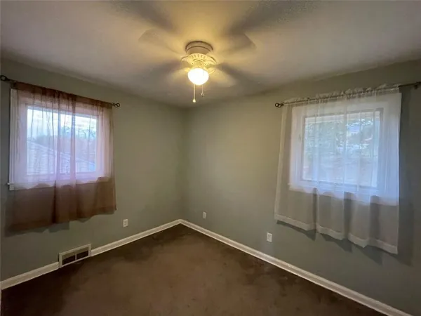 en empty room with windows