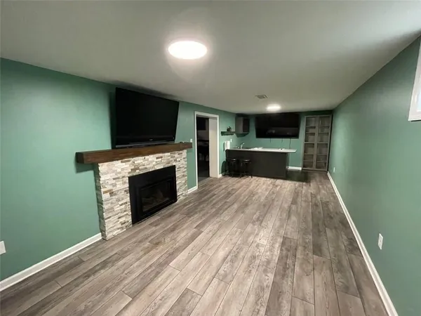 a open kitchen with a sink and a stove top oven