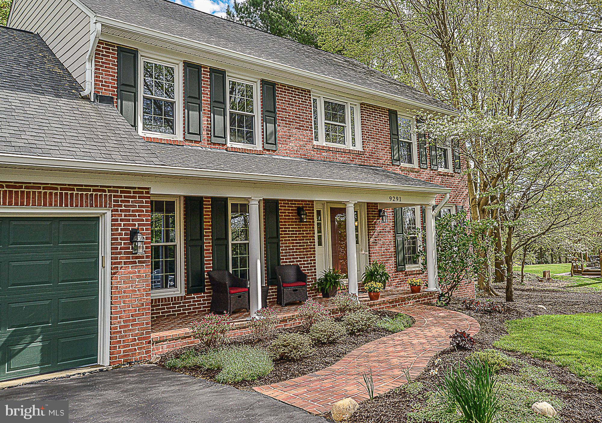 9291 Davis Drive Lorton, VA 22079 - Photo 2 of 57 Brick paver walkway leads to covered porch